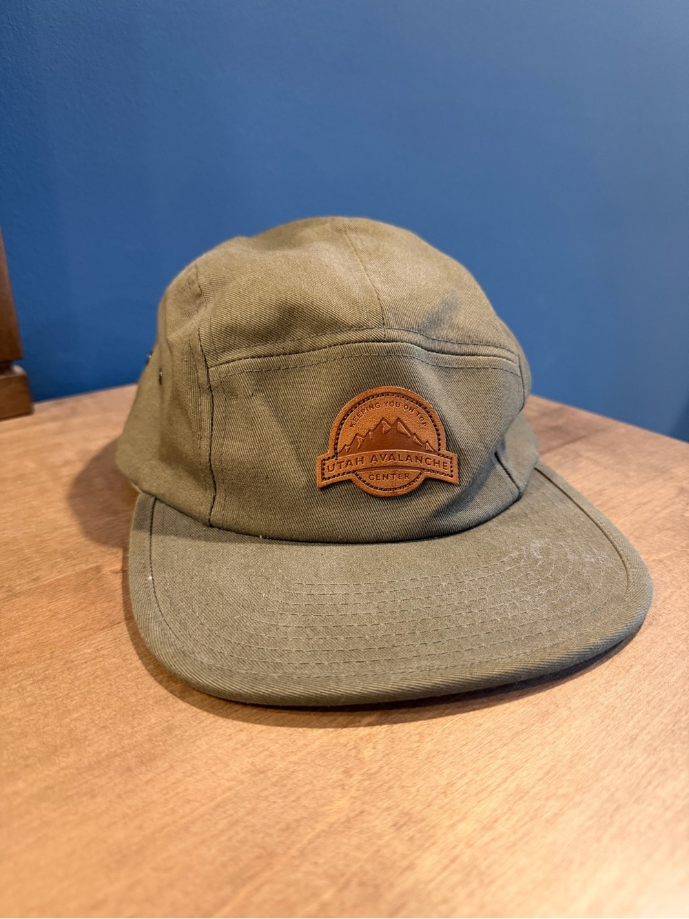 The Classic Olive Green Canvas Five-Panel Hat with Brown Patch